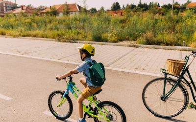 Little boy commute to school with mom by bicycles