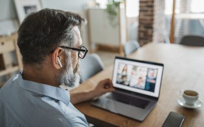 Mature men at home during pandemic isolation have conference  call